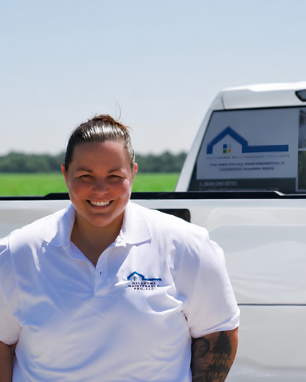 Carly Tracy, owner of Oklahoma Maintenance Pro, with a branded company truck